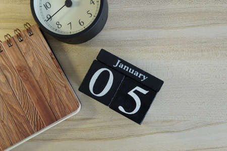 cube calendar on the wooden backgroundの写真素材