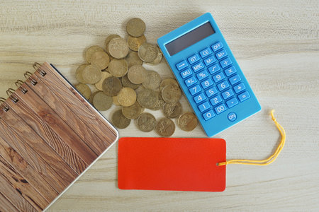 coins with note book and calculator on the table. Business conceptの写真素材