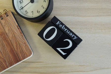 cube calendar on the wooden backgroundの写真素材