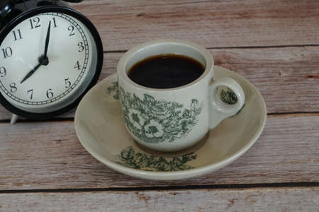 a cup of black coffee on the tableの写真素材