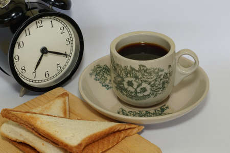 a cup of black coffee with breadの写真素材