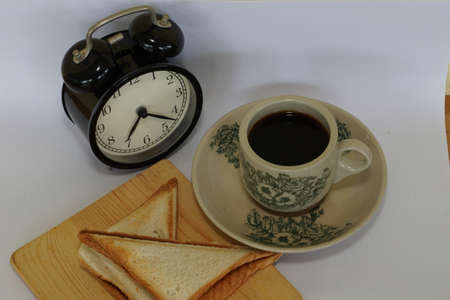 a cup of black coffee with breadの写真素材