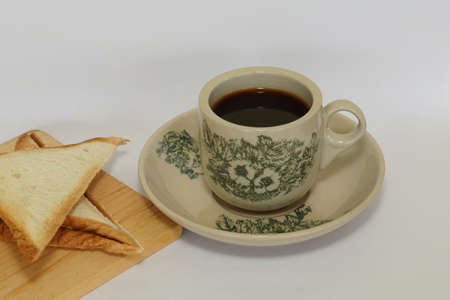 a cup of black coffee with breadの写真素材