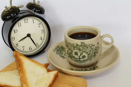 a cup of black coffee with breadの写真素材