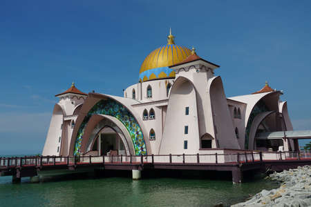 view of Malacca Straits Mosque against blue skyのeditorial素材