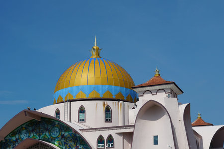 view of Malacca Straits Mosque against blue sky