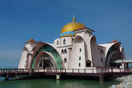view of Malacca Straits Mosque against blue skyのeditorial素材