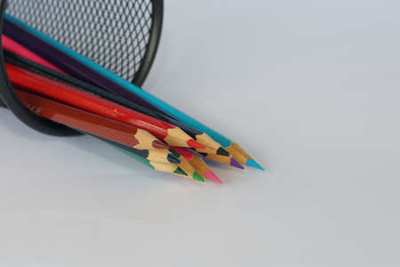 colored pencils against blue backgroundの写真素材