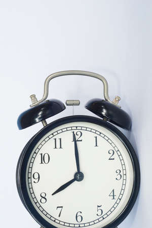 alarm clock on the tableの写真素材