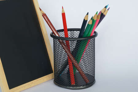 colored pencils against blue backgroundの写真素材