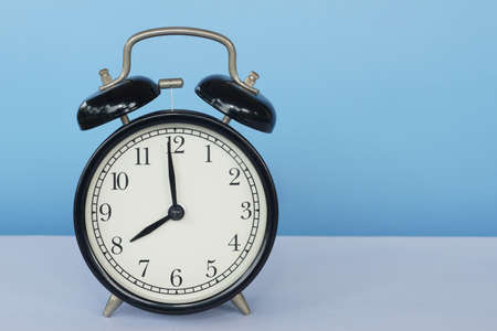 alarm clock on the tableの写真素材