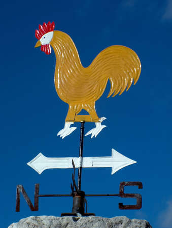 weathercock ion a roof in Italyの写真素材