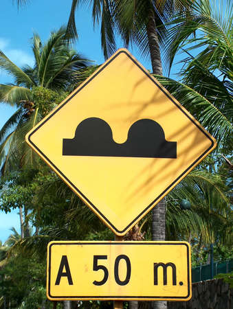 a yellow street sign in Mexicoの写真素材