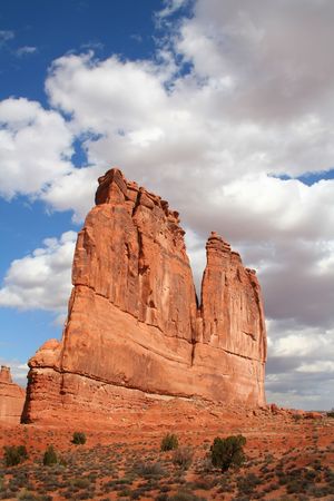 View of the red rock formations in Arches National Park with blue skys and cloudsの写真素材