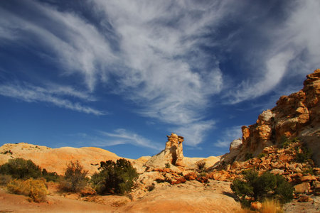 View of the red rock formations in San Rafael Swell with blue skys and cloudsの写真素材