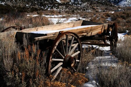 Old miners wagon lef in a fieldの写真素材