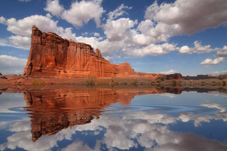 View of the red rock formations in Arches National Park with blue skyâ¬