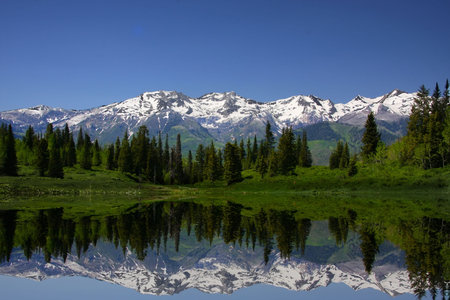 Mountain Lake showing reflections of snow capped mountains
