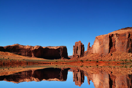 View of the red rock formations in Monument Valley with blue skys の写真素材