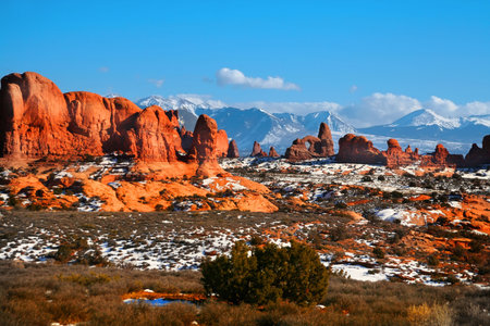 View of the red rock formations in Arches National Park with blue skys の写真素材