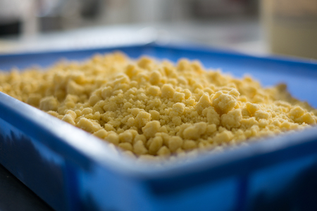Cake or Pie Pie Crumble in a blue baker's vat. The crumble is made out of sugar cookies and is typical used for the tops of pies, cakes or cheese cakes.の写真素材