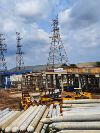 Pile of precast concrete spun pile in a construction project stockyard.の写真素材