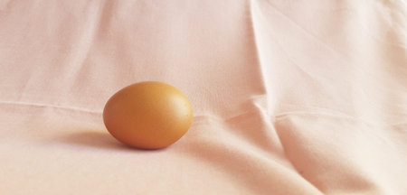 A few eggs on a pink cloth.