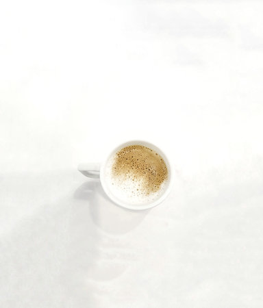 A glass of warm cappuccino that adds to the spirit in the morning.の写真素材