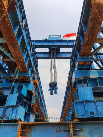 This is a photo of the steel structure of a launcher gantry that will be used for erection precast concrete I Girder (PCI Girder) across the river . This yellow gantry launcher comes from Indonesia with a capacity of up to 365 tons, with a maximum launch speed of 2,1 m/min.の写真素材