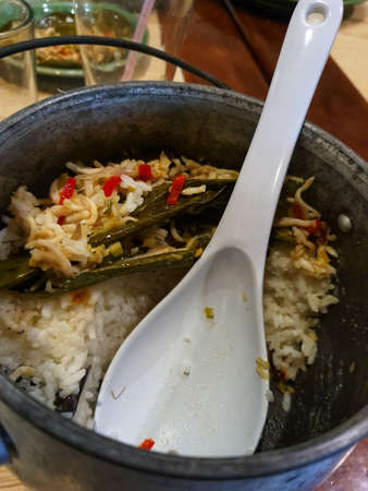 Nasi liwet, Sundanese specialty rice in the form of rice mixed with various kinds of herbs and spices, is very tasty and delicious when eaten with side dishes and chili sauce.の写真素材