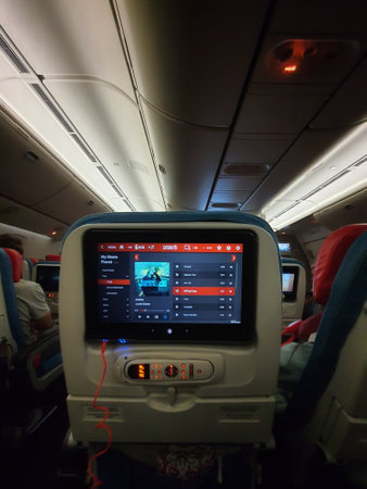 Turkey in July 2022. A screen in the passenger seat of a Turkish Airline plane is showing that the passenger is listening to Justin Bieber's song during the flight.の写真素材