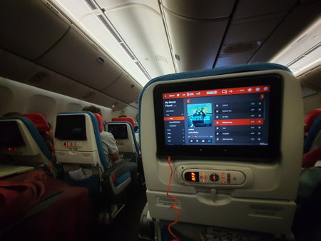 Turkey in July 2022. A screen in the passenger seat of a Turkish Airline plane is showing that the passenger is listening to Justin Bieber's song during the flight.の写真素材