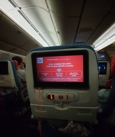 Turkey in July 2022. The interior of the passenger seat of a Turkish Airlines plane that has a touch screen for in-flight entertainment.の写真素材