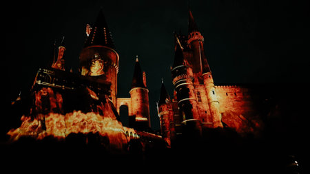 Osaka, Japan on July 8, 2019. A very beautiful light show at night at Hogwarts Castle featuring the four dormitories that you must see when you visit Universal Studios Japan.のeditorial素材