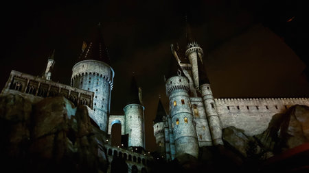 Osaka, Japan on July 8, 2019. A very beautiful light show at night at Hogwarts Castle that you must and must see when you visit Universal Studios Japan. Very tense and interesting.のeditorial素材