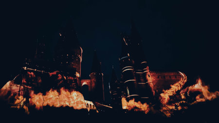 Osaka, Japan on July 8, 2019. A very beautiful light show at night at Hogwarts Castle featuring the four dormitories that you must see when you visit Universal Studios Japan.のeditorial素材