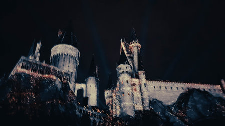 Osaka, Japan on July 8, 2019. A very beautiful light show at night at Hogwarts Castle featuring the four dormitories that you must see when you visit Universal Studios Japan.のeditorial素材