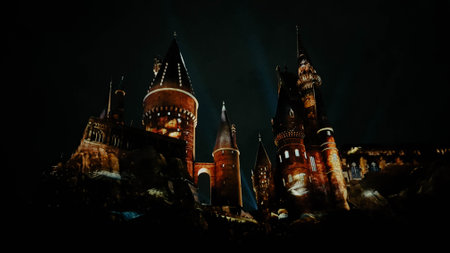 Osaka, Japan on July 8, 2019. A very beautiful light show at night at Hogwarts Castle featuring the four dormitories that you must see when you visit Universal Studios Japan.のeditorial素材