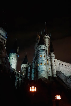 Osaka, Japan on July 8, 2019. A very beautiful light show at night at Hogwarts Castle that you must and must see when you visit Universal Studios Japan. Very tense and interesting.のeditorial素材