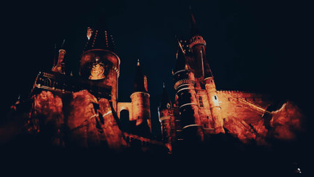 Osaka, Japan on July 8, 2019. A very beautiful light show at night at Hogwarts Castle featuring the four dormitories that you must see when you visit Universal Studios Japan.のeditorial素材
