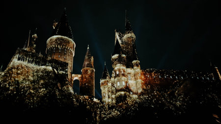 Osaka, Japan on July 8, 2019. A very beautiful light show at night at Hogwarts Castle featuring the four dormitories that you must see when you visit Universal Studios Japan.