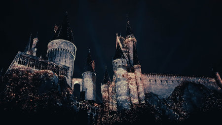 Osaka, Japan on July 8, 2019. A very beautiful light show at night at Hogwarts Castle featuring the four dormitories that you must see when you visit Universal Studios Japan.のeditorial素材