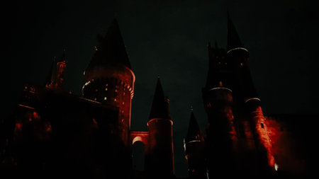Osaka, Japan on July 8, 2019. A very beautiful light show at night at Hogwarts Castle featuring the four dormitories that you must see when you visit Universal Studios Japan.のeditorial素材