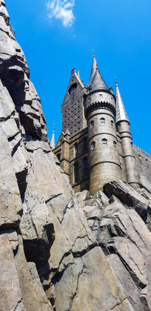 Osaka, Japan on April 8, 2019. This is a photo of the Hogwarts castle building in Universal Studio Japan in Osaka. Hogwarts is a school that functions to train children aged 11 to 18 who have magical abilities.のeditorial素材