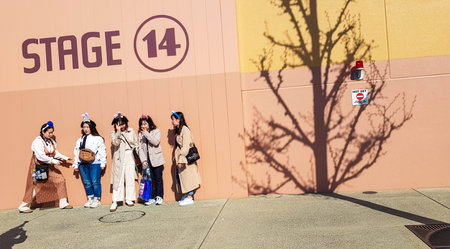 Osaka, Japan on April 9, 2019. Five Asian best friends are taking pictures in front of the Stage 14 studio facade at Universal Studios Japan. This Amusement Park does have many interesting photo spots.のeditorial素材