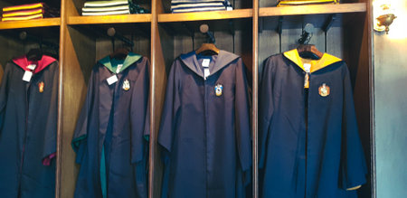 Osaka, Japan on April 2019. A souvenir shop about Harry Potter at Universal Studios Japan. One of the items on sale were robes from each of the houses at Hogwarts.のeditorial素材