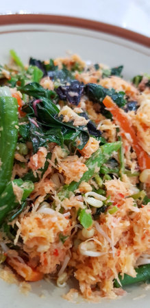 Vegetable Urap is one of the healthy foods typical of Indonesia. This traditional food is in the form of a salad consisting of boiled vegetables with spicy grated stir-fried coconut.の写真素材