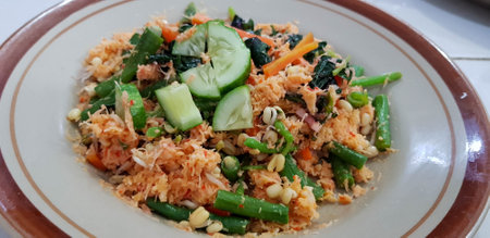 Vegetable Urap is one of the healthy foods typical of Indonesia. This traditional food is in the form of a salad consisting of boiled vegetables with spicy grated stir-fried coconut.の写真素材