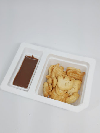 Crackes with a savory taste with chocolate dip with a sweet taste. Very tasty and suitable as a snack for children.の写真素材