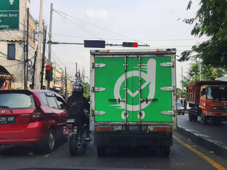 Jakarta, Indonesia in September 2022. Rear view of an ankle box car for Fast Delivery in the Greater Jakarta Area owned by Deliveree, a freight forwarder in Indonesia. Deliveree offers a wide selection of fleets ranging from economy, pickup rental, ankle のeditorial素材
